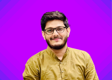 Gaurav smiling in front of camera